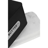 Orsina Butter Dish with a sleek black design and marble base for stylish food storage