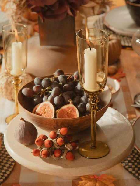 Elegant Orsina Cake Stand showcasing fruits and decorative candles for stylish table settings