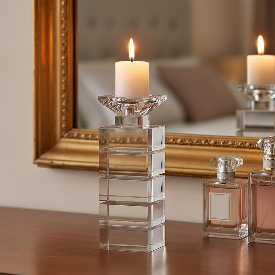 Elegant Orsina Candle Holder with a geometric design, displaying a lit candle on a wooden table