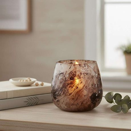 Elegant Orsina Candle Holder with a stylish marbled design, ideal for adding warmth to your home decor