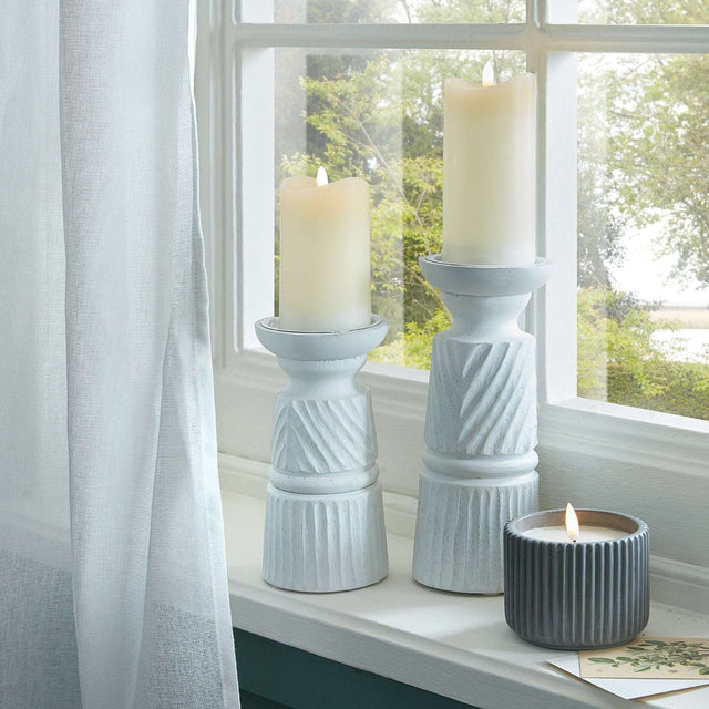 Set of decorative candle holders in white and grey for elegant home decor