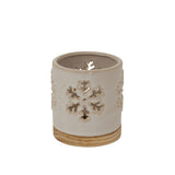 Decorative ceramic candle holder with snowflake cutouts, perfect for Christmas ambiance