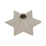 Ceramic star-shaped candle holder in soft beige, perfect for Christmas decor.