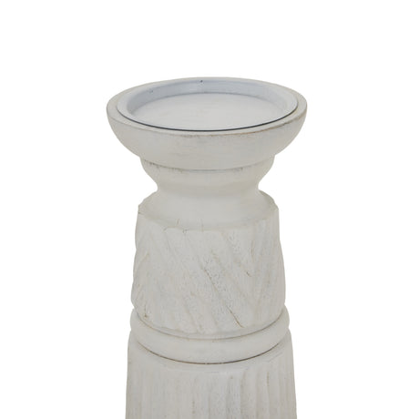 Elegant white candle holder with intricate detailing for stylish home decor and ambiance