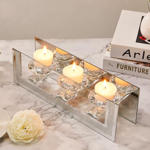 Elegant mirrored candle holder with four glass cups and lit candles, perfect for stylish decor