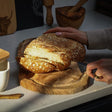 Selbrae House Carving Board made from natural wood, ideal for slicing bread and food preparation