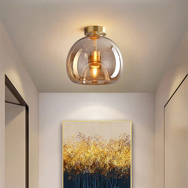 Glass Ceiling Light by Light My House with a modern design illuminating a hallway