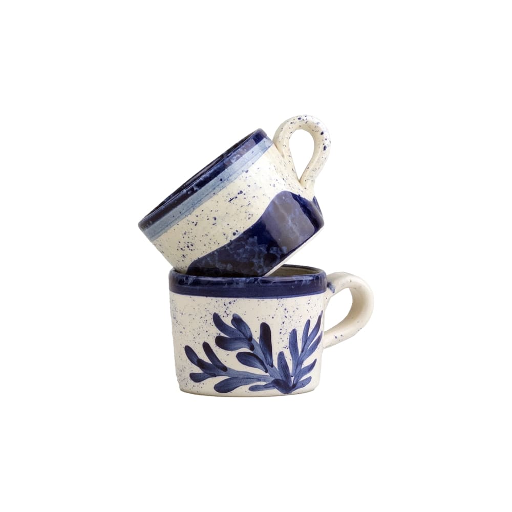 Selbrae House Ceramic Espresso Cups stacked with a floral design and navy accents