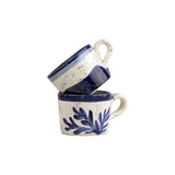 Selbrae House Ceramic Espresso Cups stacked with a floral design and navy accents