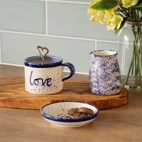 Selbrae House Ceramic Mug with Love Inscription, Accompanied by a Creamer and Plate on a Wooden Board