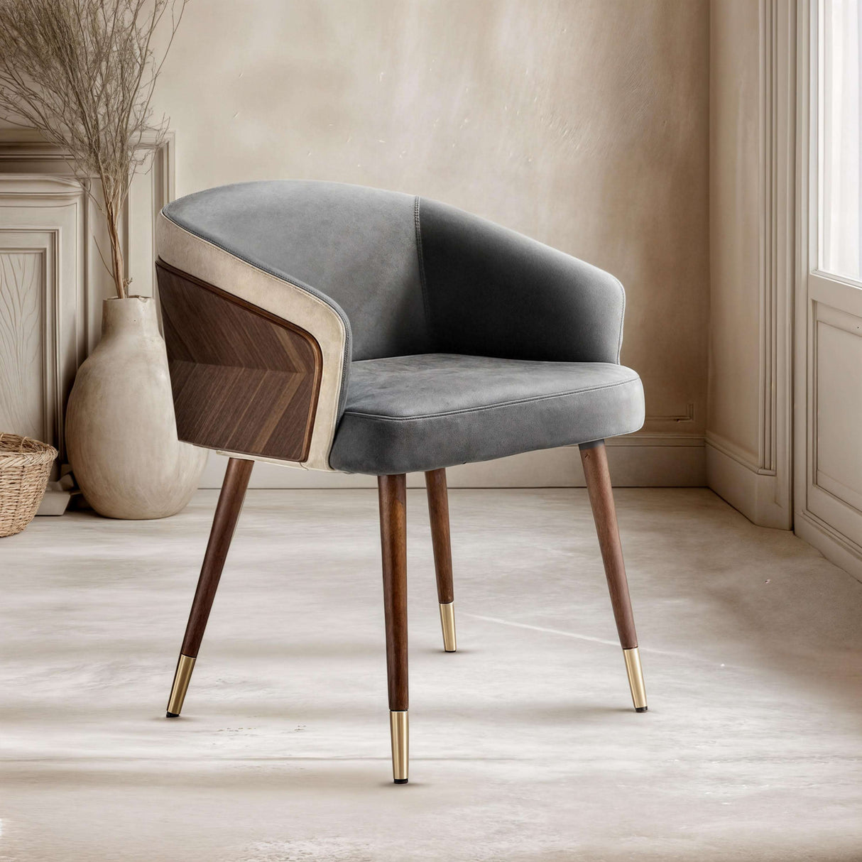Elegant Nisu Home chair featuring a grey upholstered seat and wooden legs with gold accents