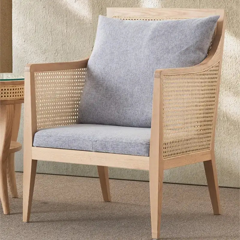 Nisu Home stylish chair with a light wood frame and comfortable grey cushion for modern interiors