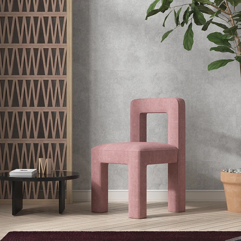 Modern Nisu Home Chair in pink fabric with a unique geometric design for contemporary interiors