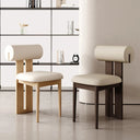 Modern Nisu Home Chair featuring a unique roll-back design with soft cushioning and wooden legs