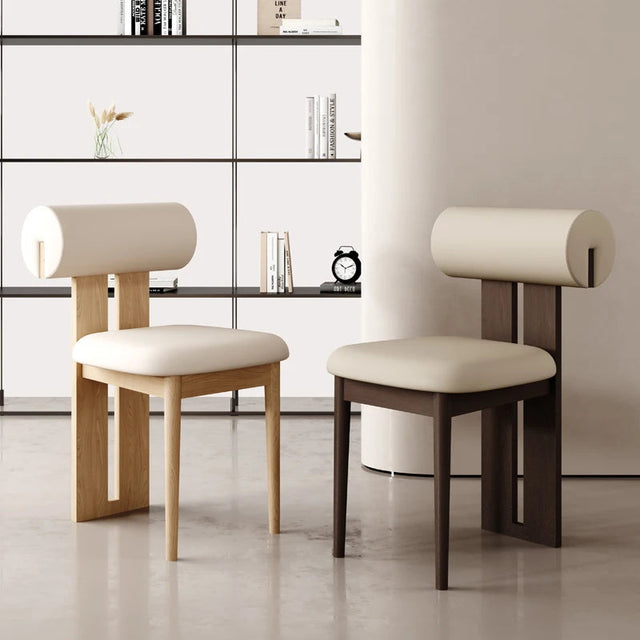 Modern Nisu Home Chair featuring a unique roll-back design with soft cushioning and wooden legs