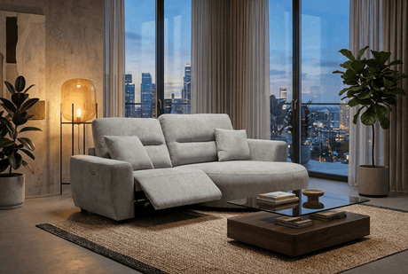Contemporary grey chaise lounge in modern living room with city view and stylish decor