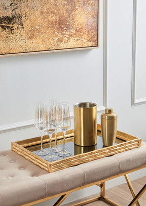 Elegant Orsina Champagne Glasses displayed on a gold tray with a cocktail shaker and ice bucket