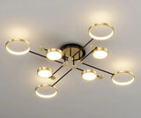 Modern chandelier with seven circular LED lights in a stylish gold finish for elegant interiors