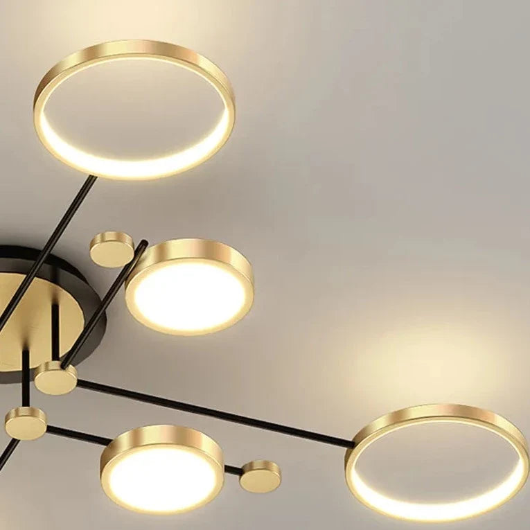 Modern Light My House chandelier featuring gold rings and sleek design for contemporary interiors