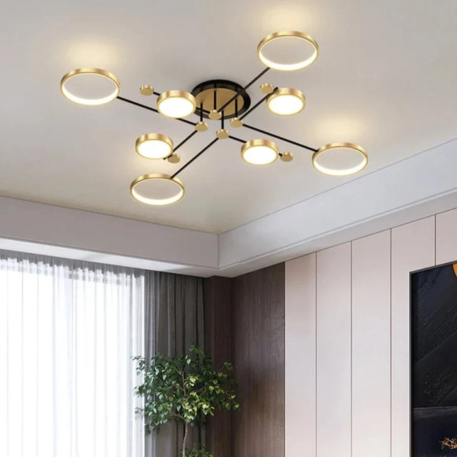 Stylish modern chandelier from Light My House with sleek gold finish and circular light fixtures