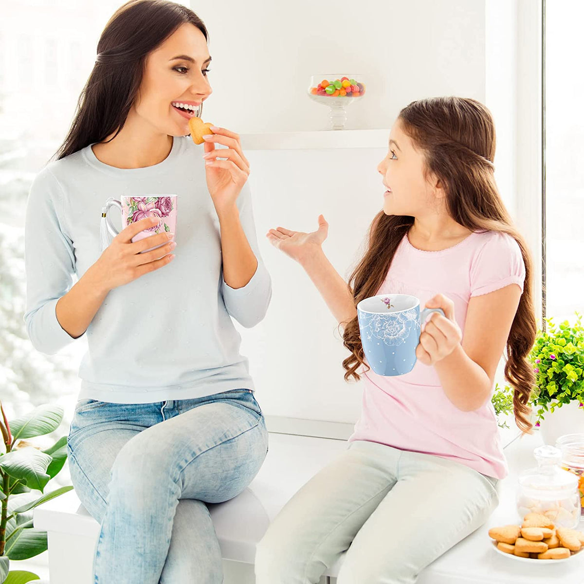 A mother and daughter enjoying biscuits with a China Mugs Set by London Boutique Lifestyle in a bright setting