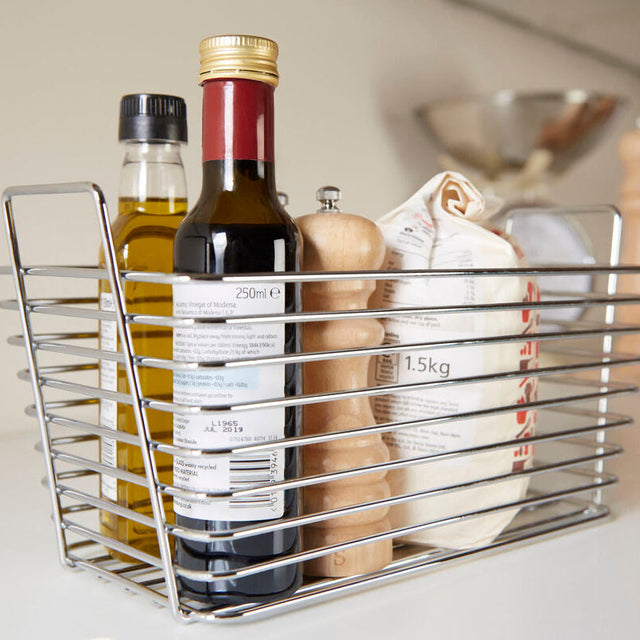 Orsina Chrome Caddy for storing kitchen essentials like oils and spices in a sleek metal design