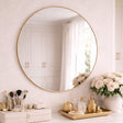 Jobu Home Circle Mirror with a sleek gold frame and elegant decor on the vanity below