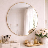 Jobu Home Circle Mirror with a sleek gold frame and elegant decor on the vanity below
