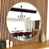 Jobu Home Circle Mirror with a sleek gold frame, ideal for modern interior decor