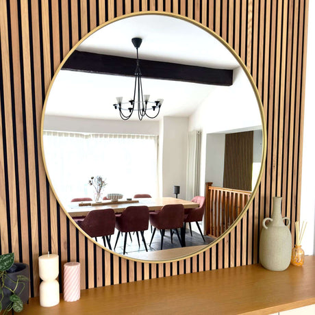 Jobu Home Circle Mirror with a sleek gold frame, ideal for modern interior decor