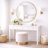 Elegant Circle Mirror with Gold Frame above a White Console Table in a Bright Bedroom