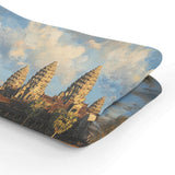 HOME ART HAVEN Throw Blanket featuring a scenic design of ancient temples and a cloudy sky