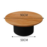 Nisu Home Coffee Table with a 90CM round wooden top and a sleek black base
