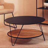 Modern Orsina Coffee Table with a sleek black top and woven lower shelf for stylish living rooms
