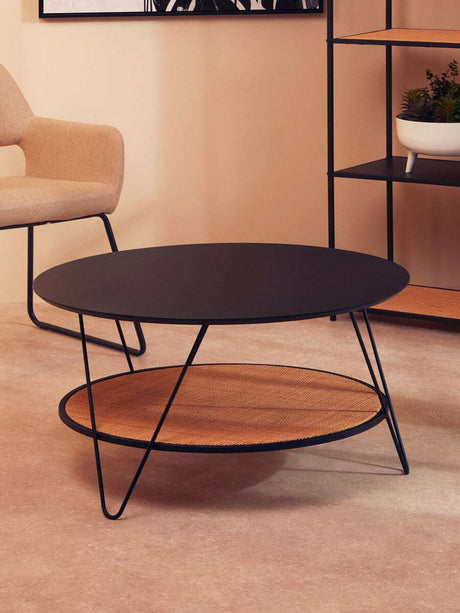 Orsina Coffee Table with a sleek black top and woven lower shelf for stylish living room decor
