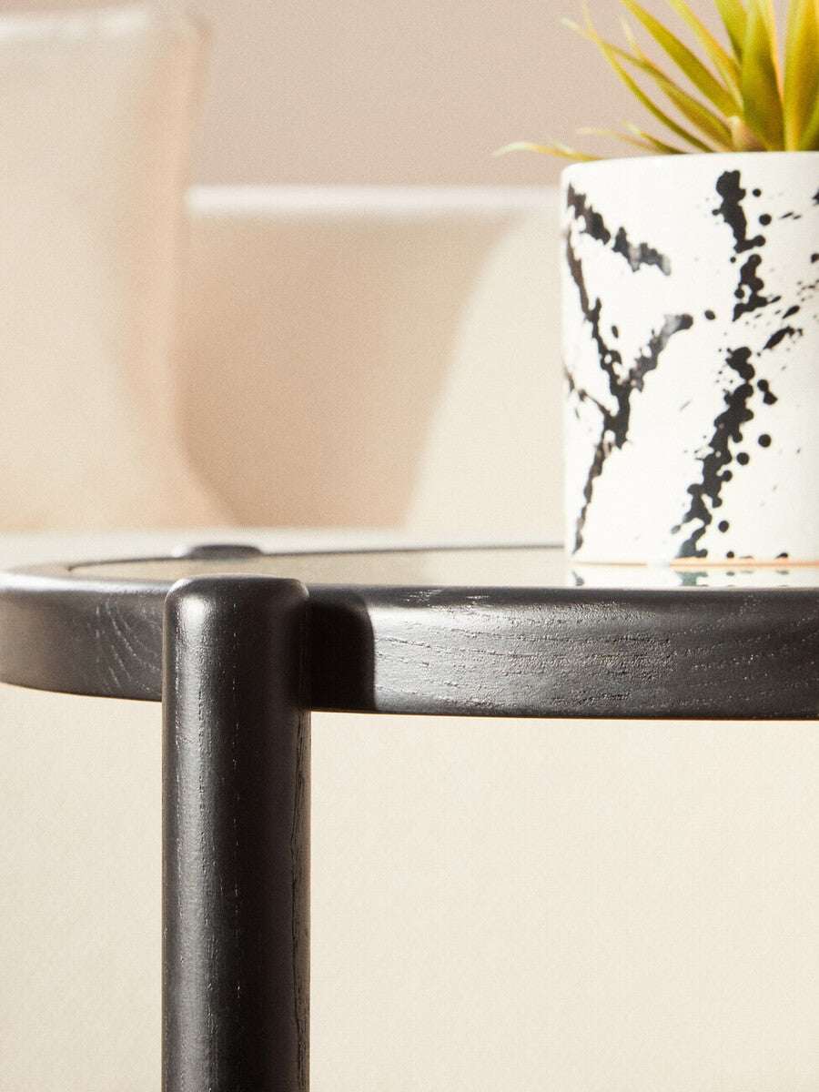 Orsina Coffee Table with a sleek black finish and a minimalist design, perfect for modern living spaces