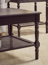 Orsina Coffee Table in black wood with turned legs and a lower mesh shelf for storage