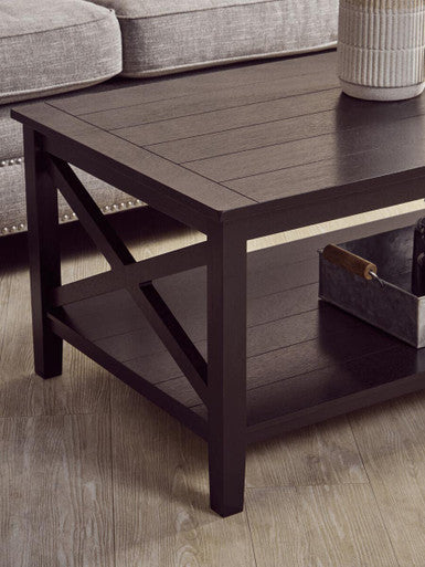 Orsina Coffee Table with a dark wood finish and modern cross-frame design for contemporary living rooms