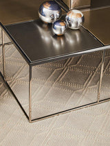 Orsina Coffee Table with a sleek mirrored surface and decorative silver spheres on top