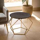 Modern Orsina Coffee Table with a round black top and geometric gold base for stylish living spaces
