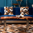 Orsina Coffee Table with Natural Wood Finish and Stylish Metal Legs in a Modern Living Room Setting