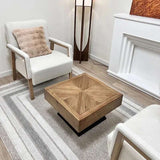 Stylish Nisu Home Coffee Table with a geometric design, set in a modern living room with armchairs