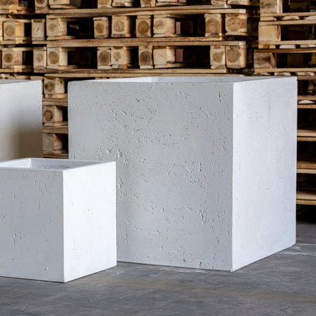 Set of Jobu Home concrete planters in various sizes, perfect for modern indoor gardens