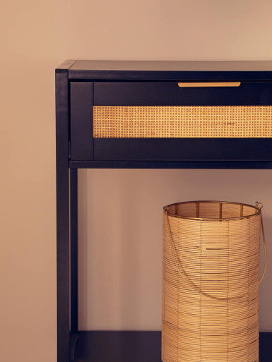 Orsina Console Table featuring a sleek design with rattan accents and a stylish drawer