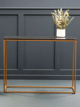 Orsina Console Table with a sleek black top and gold metal frame, perfect for hallways