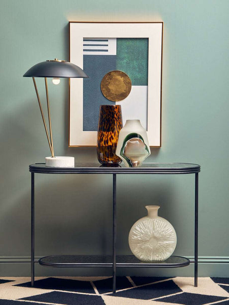 Orsina Console Table in Black with Decorative Vases and Stylish Lamp on Top