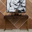 Stylish Orsina Console Table with two drawers and a sleek metal frame against a modern wall art backdrop