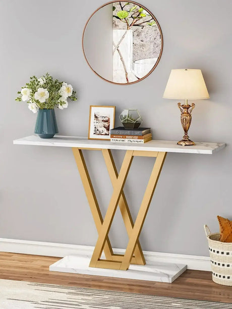 Klassyx Console Table with a sleek design featuring gold legs and a marble top in a stylish living space