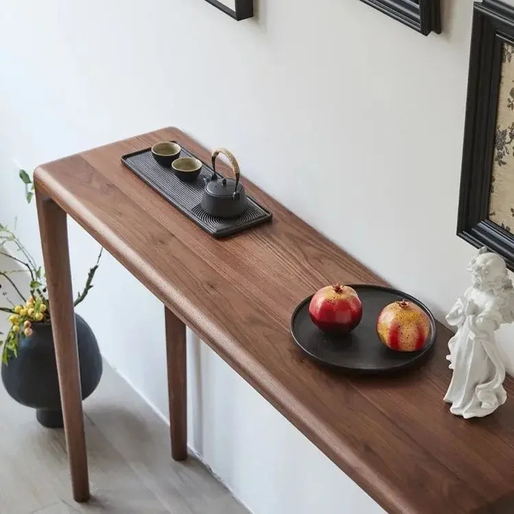Nisu Home Console Table in wood finish, elegantly styled with decorative items and fruits