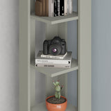 Decortie Corner Bookcase in pastel green with shelves displaying books, a camera, and a potted plant
